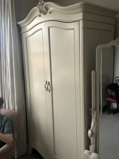 Elegant Wardrobe with Ornate Detailing — image 2