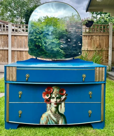 Vintage blue dresser with mirror and decorative details